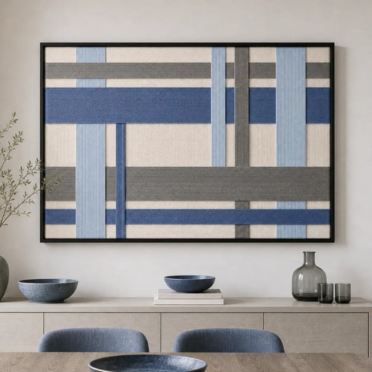 Blue and grey geometric hand-woven wool tapestry beautifully staged in a bright dining room over a sleek wooden sideboard.