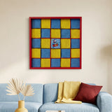 soft cotton cord wall art with a yellow and blue checkerboard pattern and a Snoopy astronaut center displayed above a blue sofa.