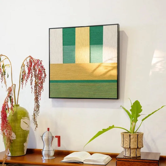 Spring Breeze Wheat Field hand-woven yarn wall art styled on a tabletop next to crafting tools and yarn balls, highlighting precise stripe alignment and vibrant color palette
