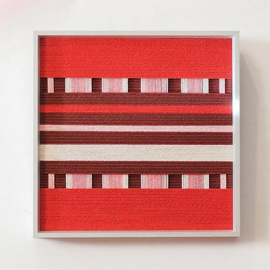 Front view of Spring Miss yarn wall art showing its exact square format and alternating red, burgundy, and cream stripes on a clean white background.
