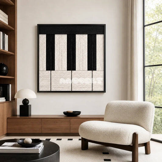Little Black Piano SQ006 black and white hand-wrapped yarn wall art above a wood console beside a cream chair in a bright reading corner