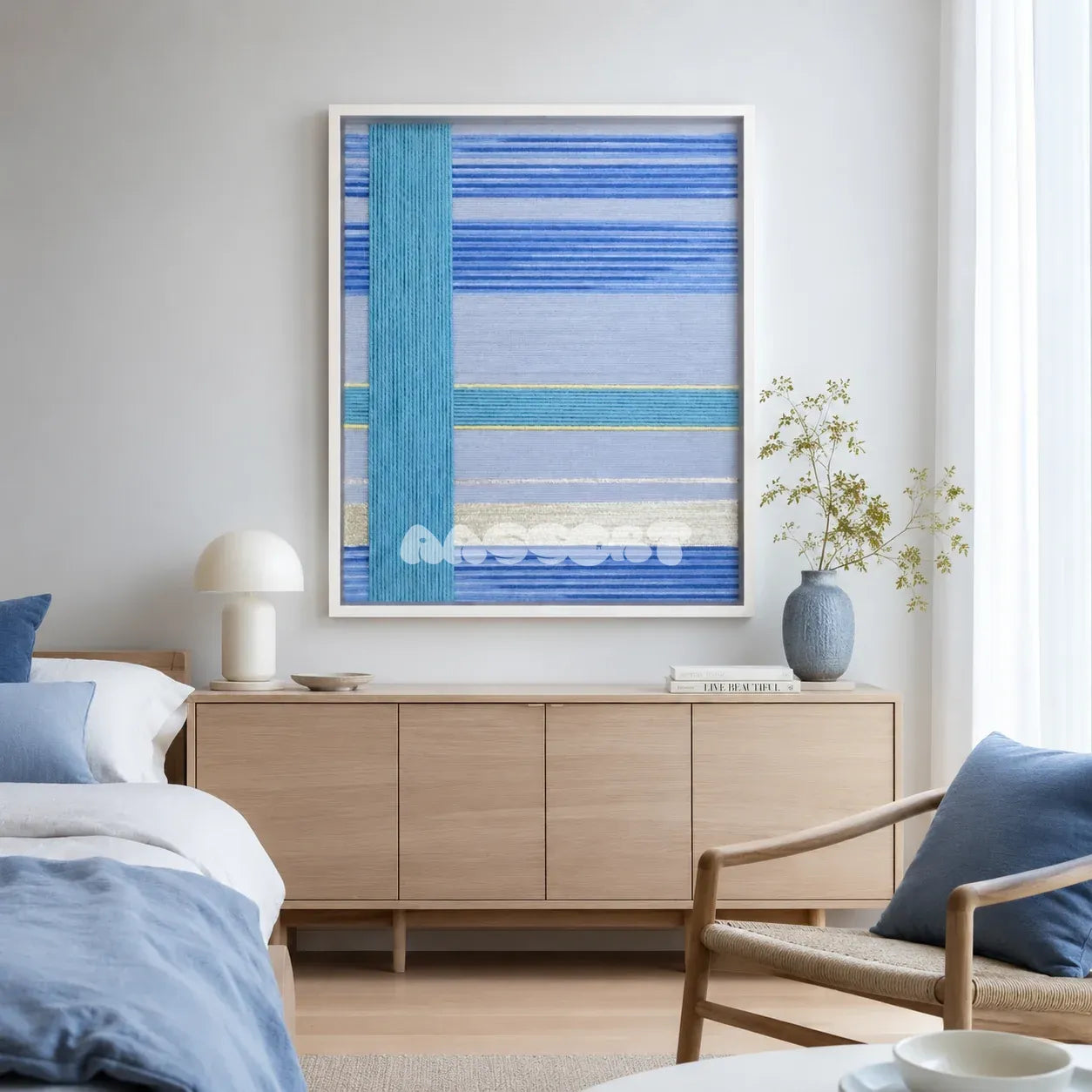 Blue Sea SQ008 blue cyan silver and yellow soft cotton cord wall art above a light wood sideboard in a serene modern bedroom