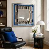 Inception SQ016 framed textile mirror art above a black leather chair in a bright reading corner