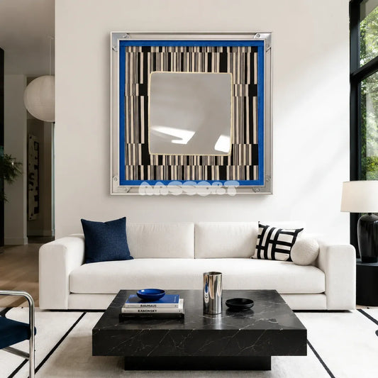 Inception SQ016 framed textile mirror art with a blue border above a white sofa in a modern living room