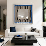 Inception SQ016 framed textile mirror art with a blue border above a white sofa in a modern living room