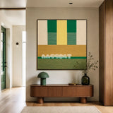 Wheat Field SQ017 green and yellow framed textile art above a curved wood console in a modern entryway