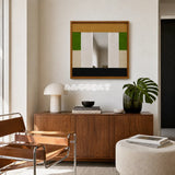 Pastoral Elegance SQ018 framed textile mirror art above a walnut cabinet in a lounge with a tan leather chair