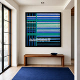 Blues Harmony SQ019 blue and teal framed yarn art above a simple wood bench in a minimalist entryway