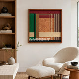 Christmas Melody SQ022 framed yarn and wood art above a white boucle chair in a bright reading corner