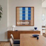 Mountain and River SQ023 blue and beige framed yarn art above a wood sideboard in a minimalist dining room