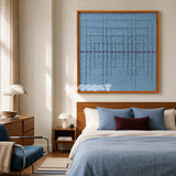 Blue Bridge Over the Pond SQ024 light blue framed yarn art above a wood bed in a serene blue bedroom