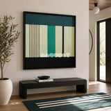 Green Branches SQ027 green cream and black framed yarn art above a black bench in a bright modern entryway