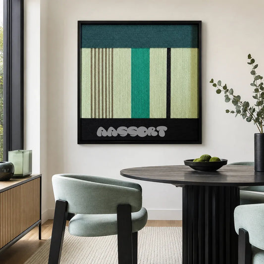 Green Branches SQ027 green cream and black framed yarn art above a round table in a bright modern dining room