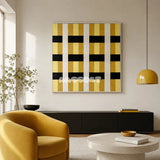 Downton Manor SQ031 mustard gold black and white framed yarn art above a black sideboard beside a yellow chair in a modern living room