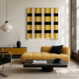 Downton Manor SQ031 mustard gold black and white framed yarn art above a yellow chaise lounge in a modern living room