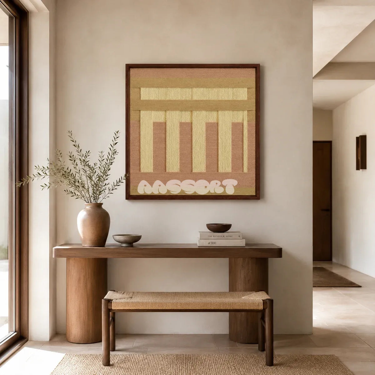 Autumn Mountain SQ034 tan blush and golden yellow framed yarn art above a wood console and woven bench in a bright entryway