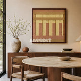 Autumn Mountain SQ034 tan blush and golden yellow framed yarn art above a wood sideboard beside a round dining table