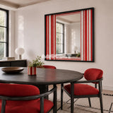 Wave Tide SQ035 red and white striped framed yarn mirror art beside a black round table and red chairs in a modern dining room