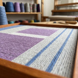 Material Mass SQ084 textile art shown with yarn spools and studio tools highlighting its soft cotton cord craftsmanship.