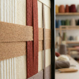 Side studio view of Captured Radiance SQ091 highlighting its dimensional yarn layers and soft cotton cord craftsmanship.