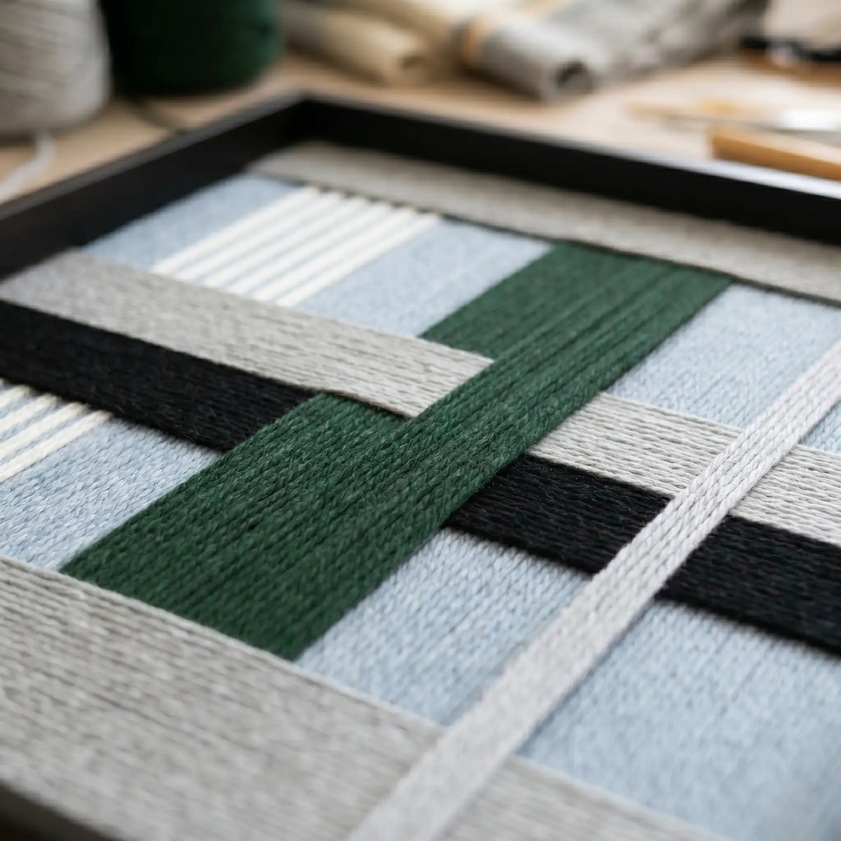 Macro view of Moonlight Glade SQ092 showing forest green, navy, and light blue soft cotton cord texture.