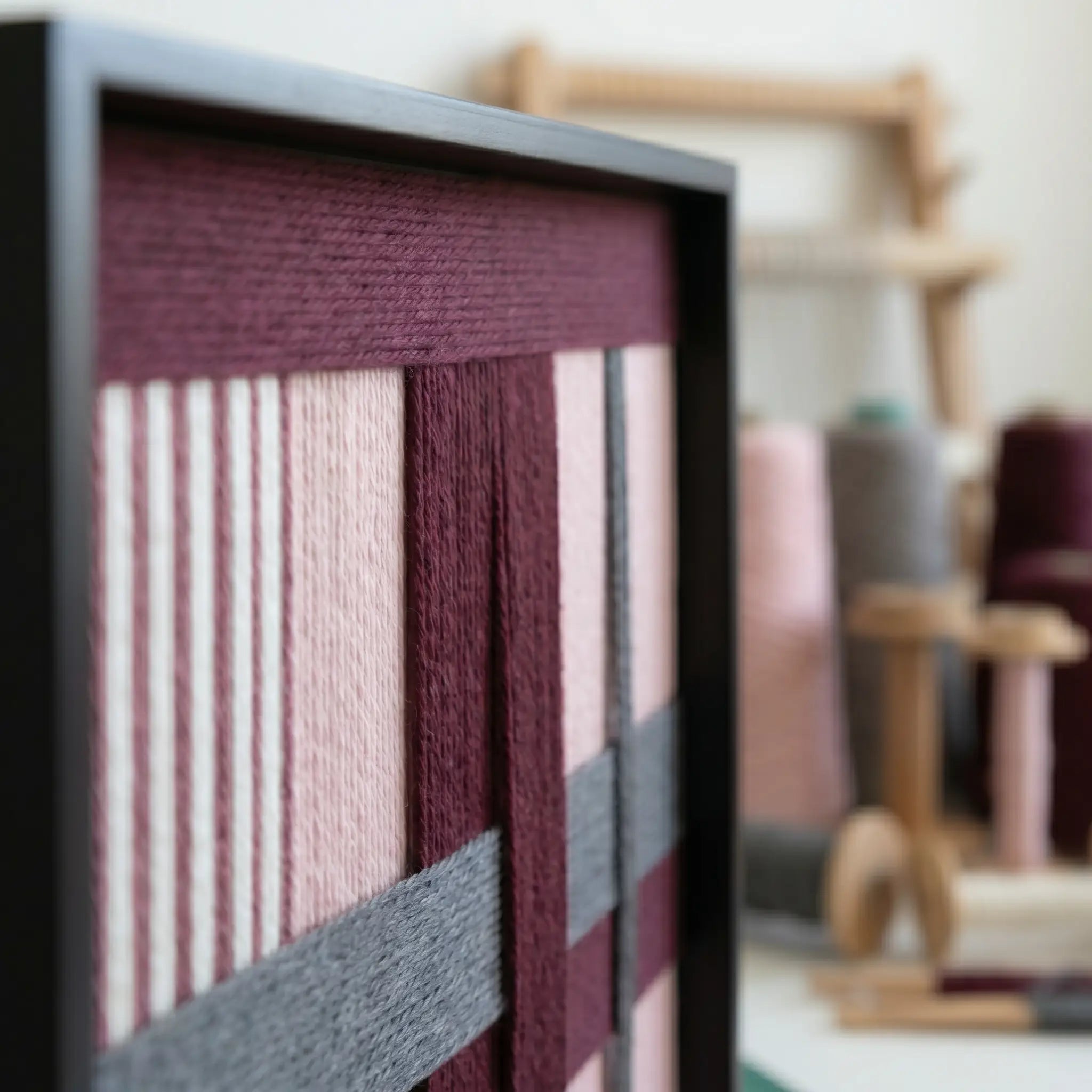 Close-up side view of Rose Coordinates SQ093 showing burgundy, dusty rose, and gray soft cotton cord texture.