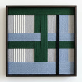 Front view of Polar Forest SQ094 geometric yarn wall art in a black square frame on a white background.