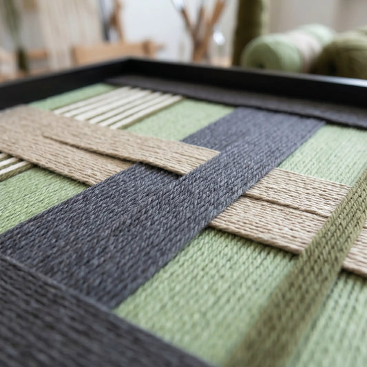Side profile of Misty Forest SQ097 showing the sleek black frame and dense hand-wrapped yarn texture.