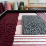 Angled studio close-up of Burgundy Overture SQ098 highlighting multi-directional soft cotton cord craftsmanship.