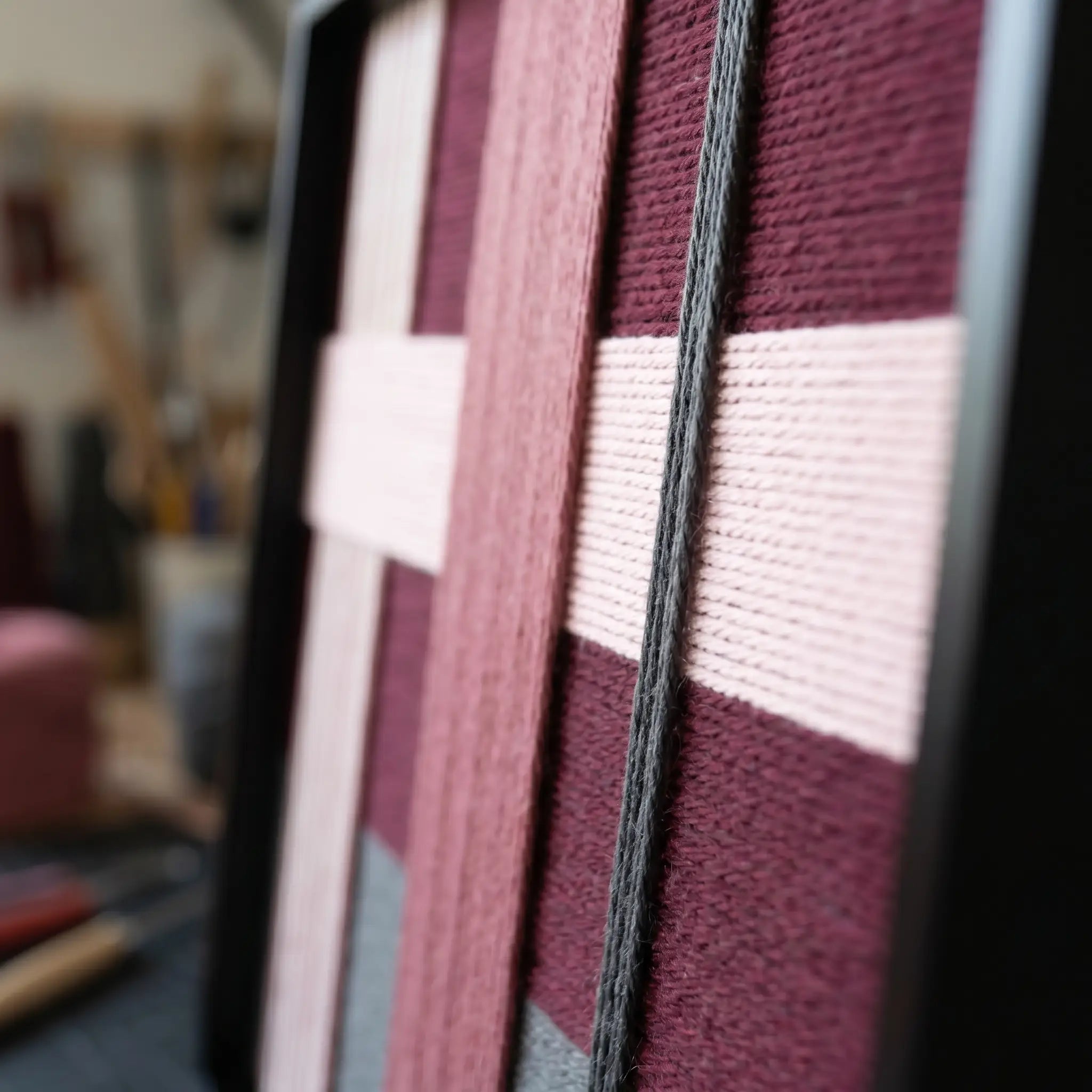 Angled view of Lilac Whispers SQ101 highlighting multi-directional yarn layering and dimensional craftsmanship.
