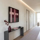 Lilac Whispers SQ101 framed textile art displayed above a black console in a minimalist hallway.