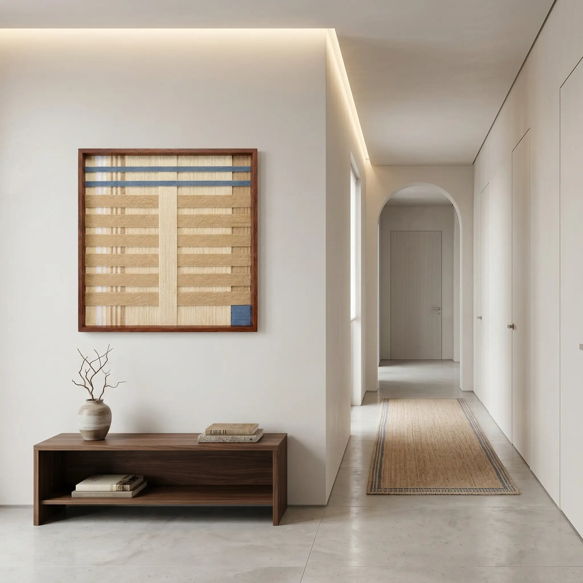 Breathing Shallows SQ105 textured yarn wall art displayed above a wooden bench in a minimalist hallway.