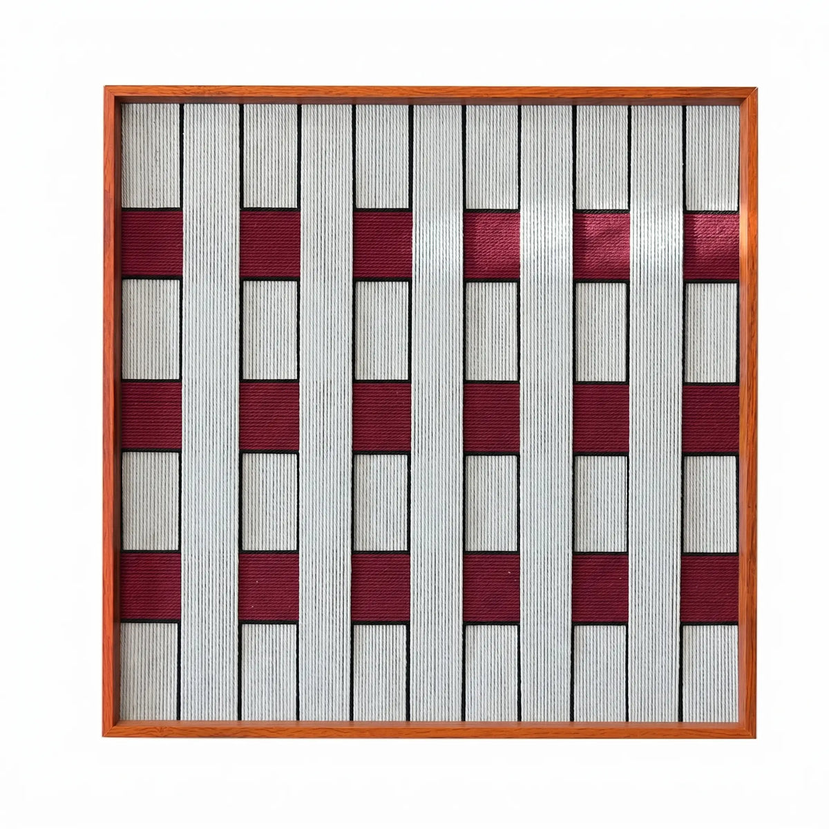 Front view of Ruby Lattice SQ106 gray and burgundy checkerboard yarn wall art in a frame on a white background.