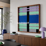 Winter Aurora SQ112 framed fiber artwork featuring cobalt blue, black, mint green, gray, and lavender yarn blocks.
