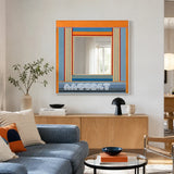 Miami Sunsets SQ118 textile mirror art with orange, ocean blue, cream, sky blue, red, and black geometric yarn.