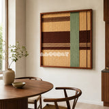 Cedar and Sage SQ119 framed yarn wall art featuring a green vertical pillar over warm brown and beige bands.
