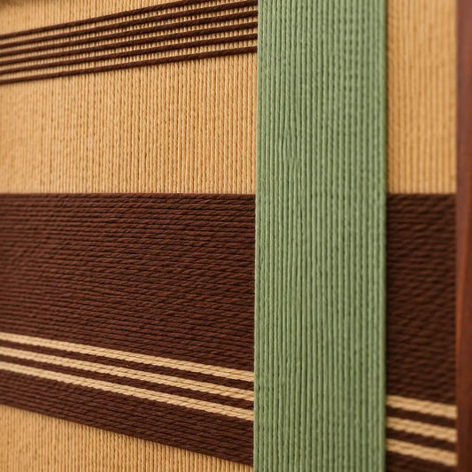 Close-up of Cedar and Sage SQ119 showing raised sage green yarn layered over cedar brown and golden beige bands.