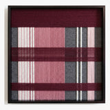 Front view of Merlot Veil SQ133 burgundy, pink, grey, and white geometric yarn wall art in a black frame.