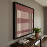 Nostalgic Bloom SQ136 framed textile wall art displayed above a dark wood console table in a softly lit hallway.