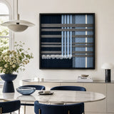 Starry Latitude SQ145 framed textile art with navy blue, icy blue, and cream architectural yarn geometry.