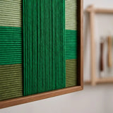 Side view of Garden Grid SQ148 showing dimensional woven yarn texture and the depth of its frame.
