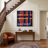 View of Silent Axis framed textile wall art, featuring navy, terracotta, and wheat yellow cotton cord arranged in an architectural grid.