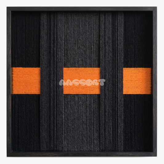 Closed Form, framed textile wall art with three orange blocks across layered black vertical bands.