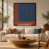Held Space textile wall art displayed above a neutral sofa in a living room.