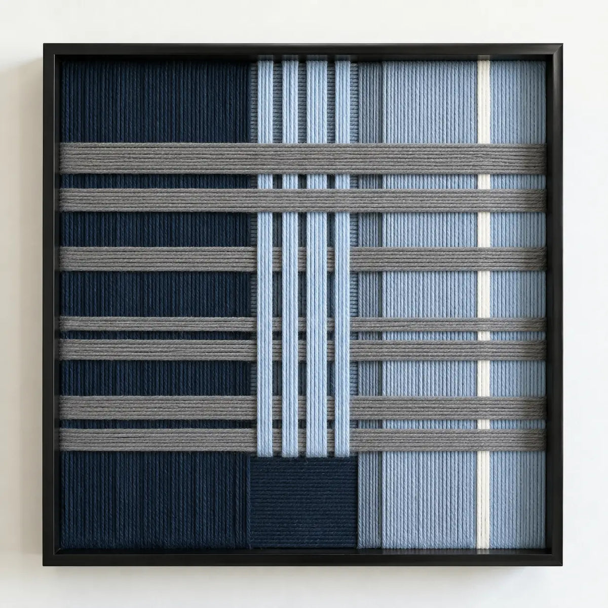 Frontal studio shot of the Starry Latitude square framed wall art featuring a sophisticated navy, blue, and cream geometric tapestry.