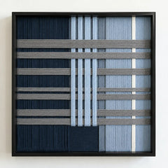 Frontal studio shot of the Starry Latitude square framed wall art featuring a sophisticated navy, blue, and cream geometric tapestry.