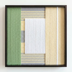 Frontal studio shot of the main Sun-Baked hand-woven wool wall art in a square black frame against a clean white background.