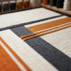 Detailed view of the Sunset Construct fiber art in a studio setting showing the precise layered winding technique of the wool.