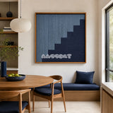 The Eighth Level blue stepped textile wall art displayed in a warm modern dining nook with natural wood furniture.