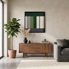 Modern hand-woven wool tapestry centered in a contemporary living space featuring a wooden cabinet and a minimalist grey sectional sofa.